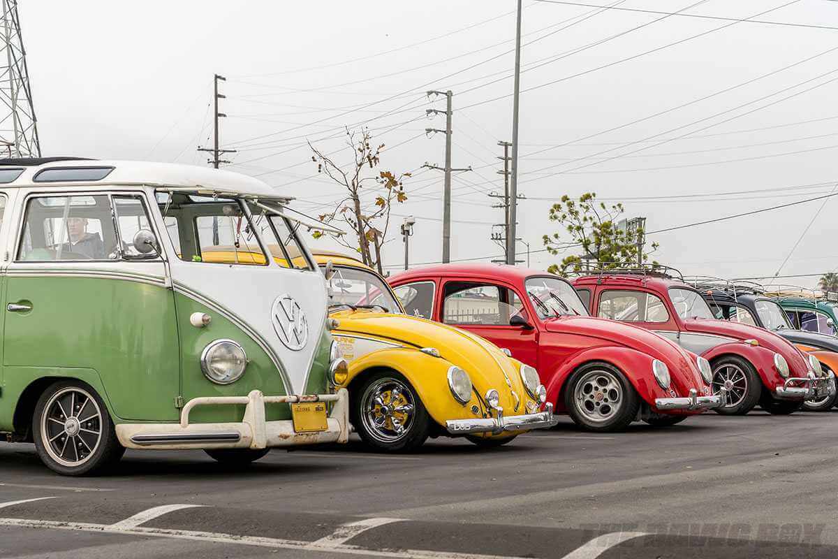 green VW Bus and yellow and red VW Beetles at Cars and Coffee South Bay Sunday